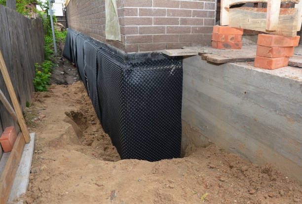 Happy homeowners after waterproofing job in Laotto